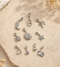 Set mit 10 goldfarbenen Charms mit Western-, Natur-, Stern- und Herzmotiven